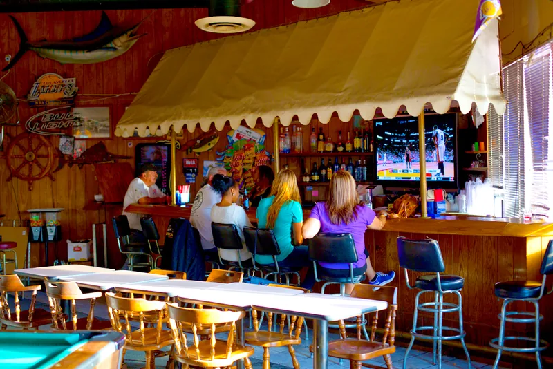 Guests at the Queen’s Wharf bar