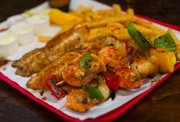 Grilled fish and shrimp combo plate at Berth 55